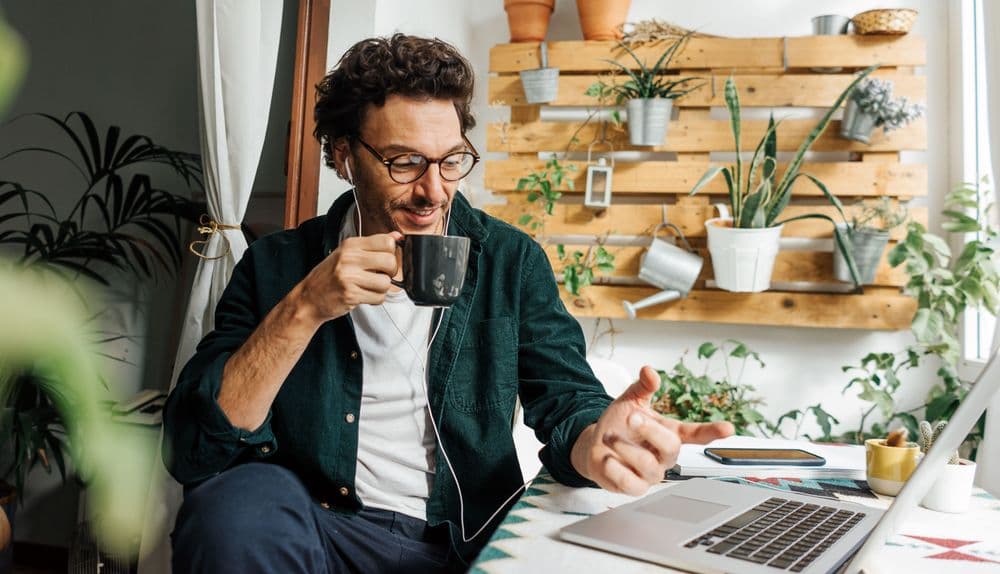 Man with laptop working remotely from home